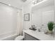 Bright bathroom features a shower-tub combination and modern fixtures at 734 Longboat Dr, Davenport, FL 33896