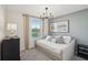 Bright bedroom features a stylish trundle bed and serene decor at 734 Longboat Dr, Davenport, FL 33896