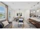 Open layout featuring a dining area and eat-in kitchen with natural light at 734 Longboat Dr, Davenport, FL 33896
