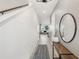 Bright hallway featuring a stylish console table and a decorative round mirror at 734 Longboat Dr, Davenport, FL 33896
