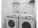Convenient laundry room with modern washer and dryer at 734 Longboat Dr, Davenport, FL 33896