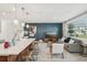 Beautiful living space showcasing a kitchen island, modern decor, and ample natural light at 734 Longboat Dr, Davenport, FL 33896