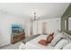 Spacious bedroom with a wall-mounted TV and ample closet space at 734 Longboat Dr, Davenport, FL 33896