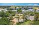 Aerial of condos surrounding a water fountain and walkway, surrounded by lush greenery at 7509 Mourning Dove Cir # 203, Reunion, FL 34747