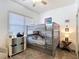 bedroom with bunk beds, coastal accents, and modern decor for a playful atmosphere at 7509 Mourning Dove Cir # 203, Reunion, FL 34747