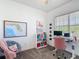 Bright bedroom with a map of Florida and desk setup at 7509 Mourning Dove Cir # 203, Reunion, FL 34747