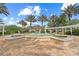 Beautiful community fountain surrounded by palm trees and lush landscaping at 7509 Mourning Dove Cir # 203, Reunion, FL 34747