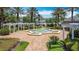 Lovely fountain area surrounded by meticulously manicured landscaping, creating a tranquil ambiance at 7509 Mourning Dove Cir # 203, Reunion, FL 34747