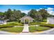 Charming community gazebo framed by lush landscaping and a 'one way' sign at 7509 Mourning Dove Cir # 203, Reunion, FL 34747