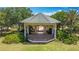 Picturesque gazebo nestled amidst lush greenery, perfect for relaxation and outdoor enjoyment at 7509 Mourning Dove Cir # 203, Reunion, FL 34747