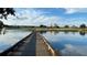 Scenic golf course view from wooden bridge over the lake, showing resort and surrounding buildings at 7509 Mourning Dove Cir # 203, Reunion, FL 34747