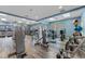 A well-equipped gym boasts modern machines, free weights, and ample natural light at 7509 Mourning Dove Cir # 203, Reunion, FL 34747