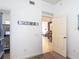 Hallway with street name sign and entryway that leads into a living room at 7509 Mourning Dove Cir # 203, Reunion, FL 34747