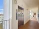 Hallway featuring an elevator, neutral walls, and access to other units at 7509 Mourning Dove Cir # 203, Reunion, FL 34747