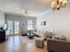 Bright living room with neutral tones and plenty of seating at 7509 Mourning Dove Cir # 203, Reunion, FL 34747