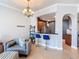 Open living area with kitchen pass-through and bar stool seating at 7509 Mourning Dove Cir # 203, Reunion, FL 34747