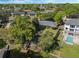 This is an aerial of a lovely home with lake access and private dock in a beautiful, established community at 7540 Lake Marsha Dr, Orlando, FL 32819