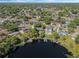 This home features a private dock, lush landscaping, and direct access to the lake at 7540 Lake Marsha Dr, Orlando, FL 32819