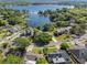 Beautiful aerial shot showcases the home and mature landscaping with waterfront access at 7540 Lake Marsha Dr, Orlando, FL 32819