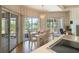 Bright dining room with lake views and sliding glass doors to the patio at 7540 Lake Marsha Dr, Orlando, FL 32819