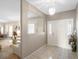 Inviting entryway with decorative tiled floor, chandelier, and views into the living room at 7540 Lake Marsha Dr, Orlando, FL 32819