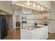 Bright eat-in kitchen with large island, modern appliances, and lots of cabinet space at 7540 Lake Marsha Dr, Orlando, FL 32819