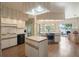 Bright eat-in kitchen with lake views, island, modern appliances, and lots of cabinet space at 7540 Lake Marsha Dr, Orlando, FL 32819