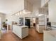 Open kitchen with large island, breakfast bar, built-in appliances, and lots of light at 7540 Lake Marsha Dr, Orlando, FL 32819