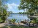 Scenic view of a serene lake with a charming wooden dock, inviting for waterside enjoyment and leisure activities at 7540 Lake Marsha Dr, Orlando, FL 32819