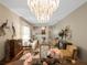 Elegant living room and dining room featuring a chandelier, and comfortable seating arrangement at 7540 Lake Marsha Dr, Orlando, FL 32819