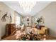 Elegant living room featuring chandelier, comfortable seating arrangement, and neutral color palette at 7540 Lake Marsha Dr, Orlando, FL 32819
