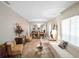 Spacious living room and dining room featuring a large mirrored wall and elegant chandelier at 7540 Lake Marsha Dr, Orlando, FL 32819