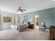 Large main bedroom with ensuite bath, walk in closet, ceiling fan and neutral decor at 7540 Lake Marsha Dr, Orlando, FL 32819