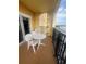 Cozy balcony with table and chairs, perfect for enjoying the view at 8101 Resort Village Dr # 3909, Orlando, FL 32821