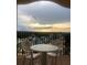 Relaxing balcony with seating and sunset views at 8101 Resort Village Dr # 3909, Orlando, FL 32821