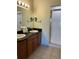 Dual vanity bathroom featuring a glass-enclosed shower for a modern and convenient bathing experience at 8101 Resort Village Dr # 3909, Orlando, FL 32821