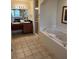 Elegant bathroom showcasing a tub and a double sink vanity, providing comfort and style at 8101 Resort Village Dr # 3909, Orlando, FL 32821