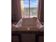 Luxurious bathroom features a jetted tub with scenic views and plush towels at 8101 Resort Village Dr # 3909, Orlando, FL 32821