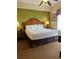 Inviting bedroom featuring a king-size bed, bedside tables, and a cozy ambiance at 8101 Resort Village Dr # 3909, Orlando, FL 32821