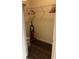 A well-organized closet featuring a secure safe, vacuum, and ample storage space with hanging rods and top shelf at 8101 Resort Village Dr # 3909, Orlando, FL 32821