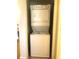 Efficient stacked washer and dryer unit in neutral tones, perfect for saving space in a modern home at 8101 Resort Village Dr # 3909, Orlando, FL 32821