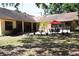 Secluded backyard featuring a fountain, ample seating, and lush tropical plants at 859 Morning Star Dr, Lakeland, FL 33810