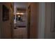 Hallway view to bright bathroom with double sinks and lots of counter space at 859 Morning Star Dr, Lakeland, FL 33810