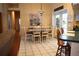 Charming dining area featuring a modern chandelier and views of the backyard through the French doors at 859 Morning Star Dr, Lakeland, FL 33810