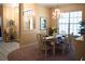 Elegant dining room featuring a chandelier and neutral decor at 859 Morning Star Dr, Lakeland, FL 33810