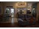 Open-concept living area with tile floors connecting the kitchen and dining space at 859 Morning Star Dr, Lakeland, FL 33810