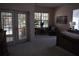 Spacious bedroom offering large windows, an outdoor entrance, and soft carpeting at 859 Morning Star Dr, Lakeland, FL 33810