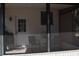Relaxing screened in patio with chairs and a small table for outdoor enjoyment at 859 Morning Star Dr, Lakeland, FL 33810