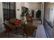 Comfortable covered porch with tile flooring, seating, and pass-through to the kitchen at 859 Morning Star Dr, Lakeland, FL 33810