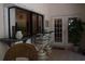 View to covered porch with bar pass-through, bar stools, and seating at 859 Morning Star Dr, Lakeland, FL 33810